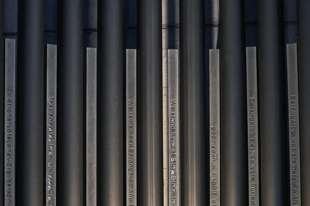 Vertical process pipework in golden industrial lighting