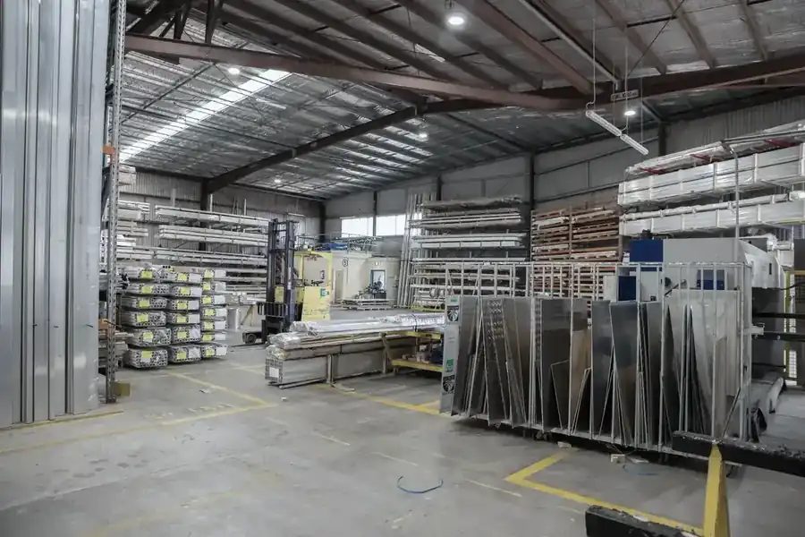 Stainless steel sheets and coils stacked in a distribution warehouse